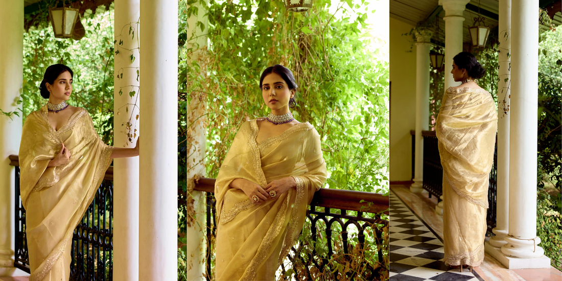 Model wearing a Gold Tissue Zardosi Saree with handcrafted embroidery and elegant detailing by Mehr by Annu.