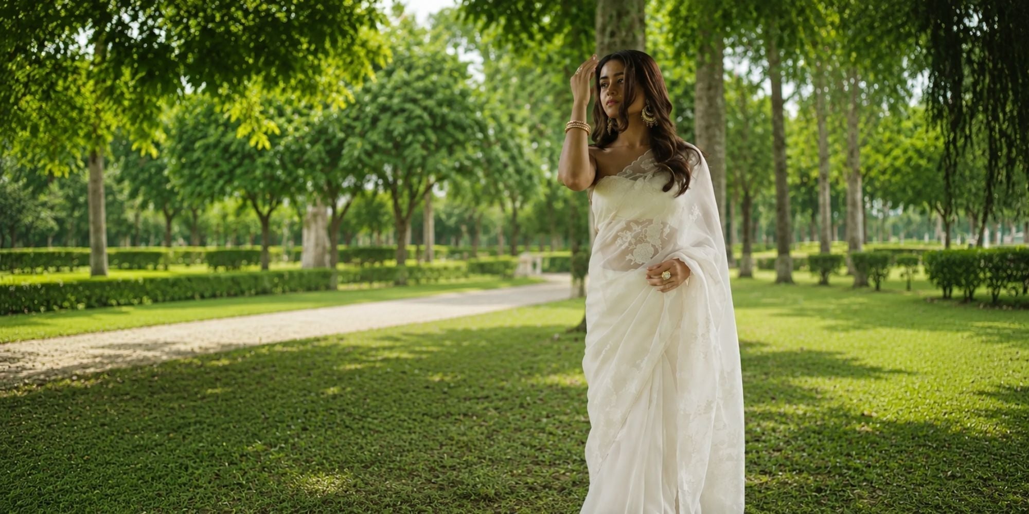 Ivory Organza Applique Saree with sheer drape and applique work