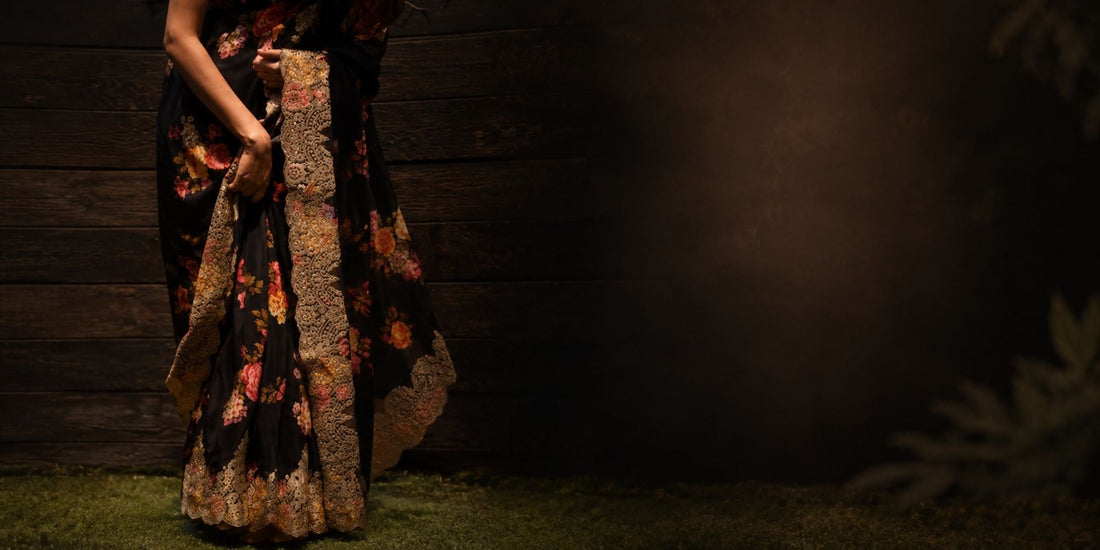 Luxury embellished black floral saree with intricate gold embroidered border and floral detailing
